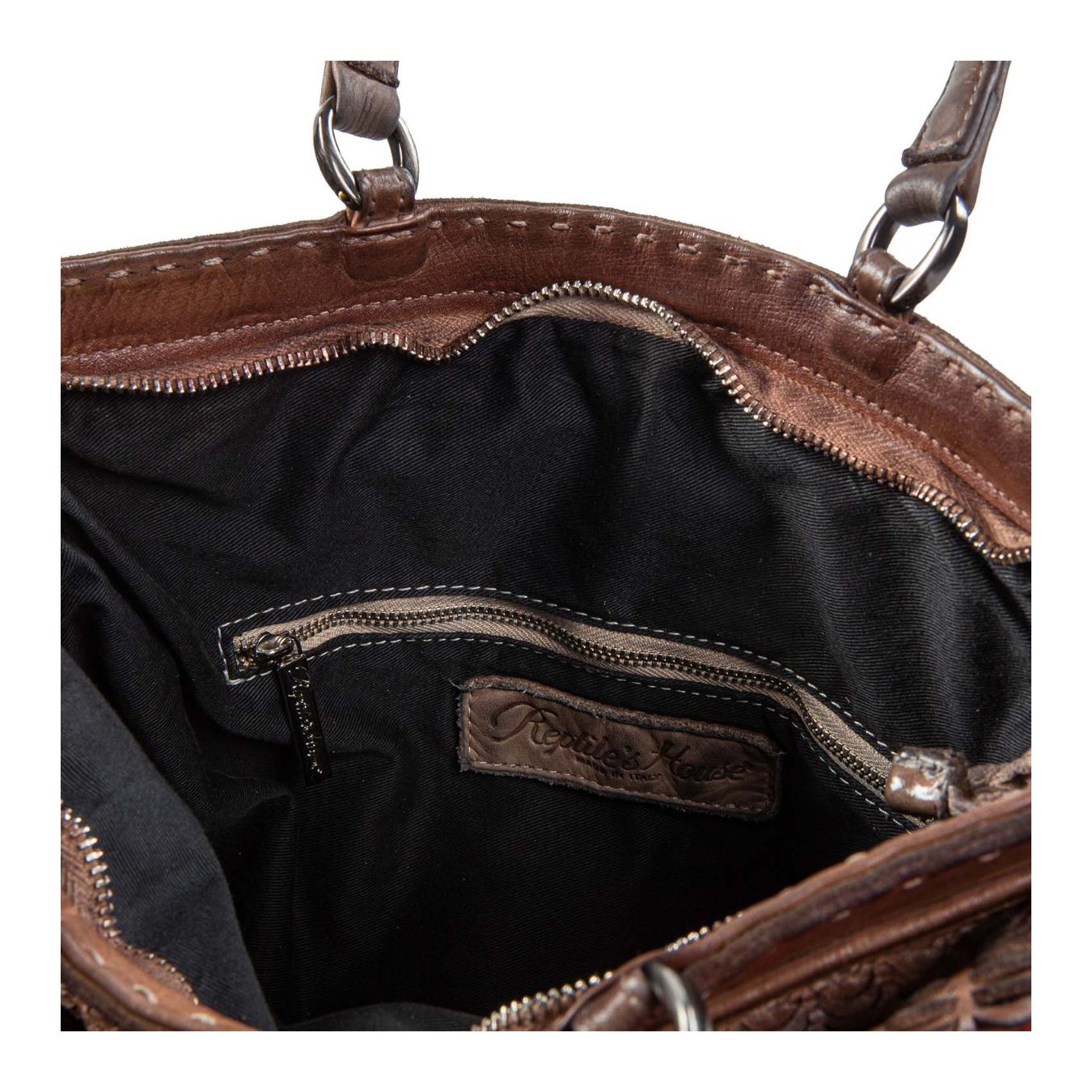 reptile's house shopper in pelle intagliata sequoia interno